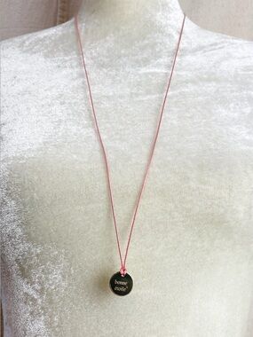 bonne etoile gold tone disc pendant pink cord necklace